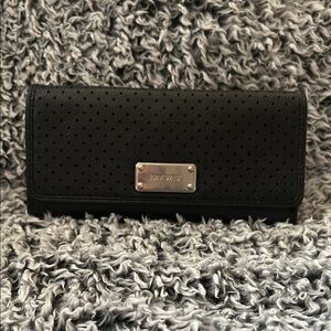 Black Wallet with Textured Material and Flap Closure